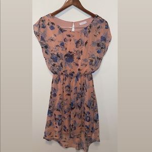 Flowy orangish/pinkish dress with blue flowers